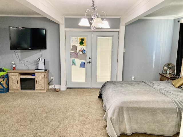 bedroom with french doors, carpet floors, a notable chandelier, and crown molding