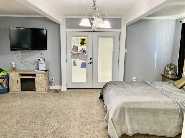 183 Sunny Gap Rd, Conway, AR 72032 - bedroom with french doors, carpet, and a chandelier