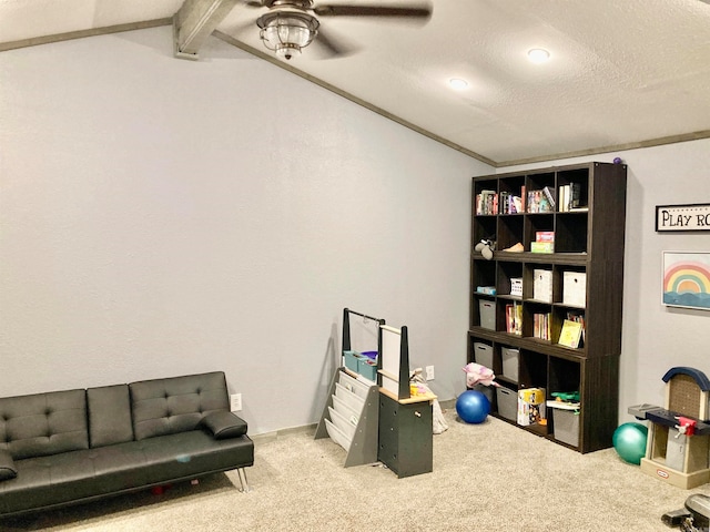 interior space with a textured ceiling, lofted ceiling with beams, carpet flooring, and ceiling fan