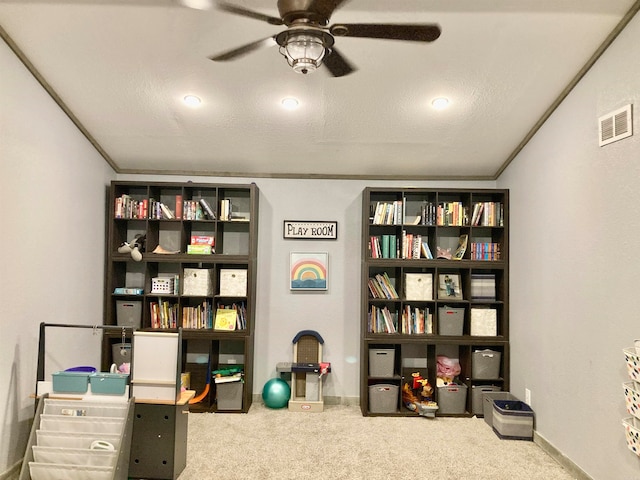 office space with a textured ceiling, carpet floors, and ornamental molding