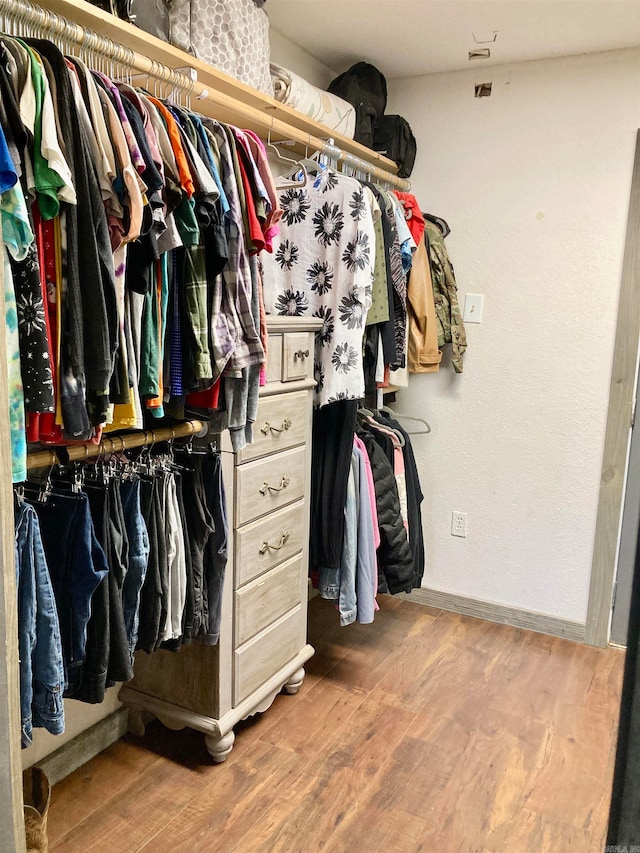 spacious closet featuring hardwood / wood-style flooring