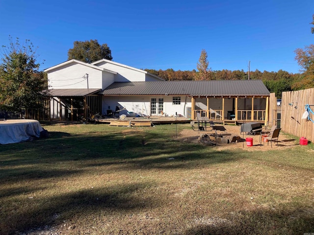 back of house with a yard and a patio area