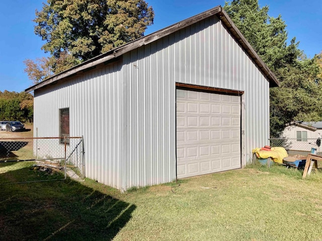 garage with a lawn