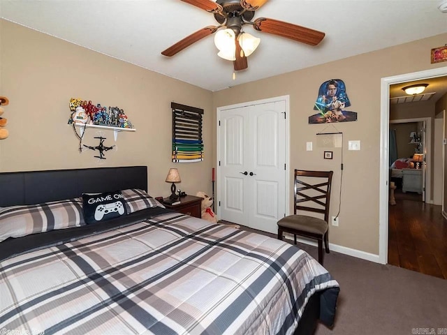 bedroom featuring ceiling fan, dark wood-type flooring, and a closet