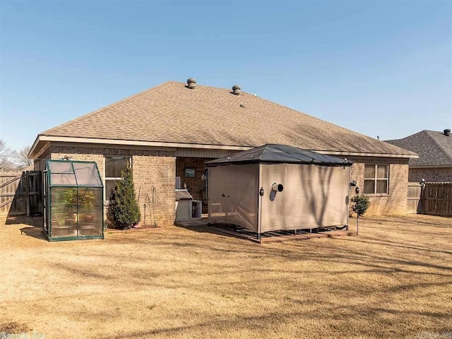 back of property with an outdoor structure