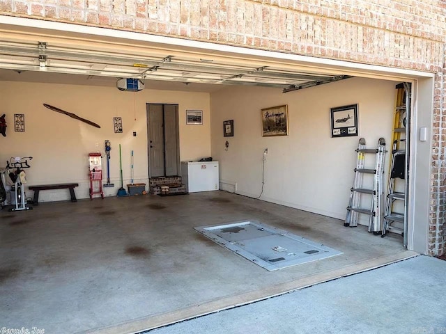 garage featuring a garage door opener