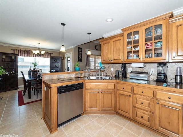 kitchen featuring pendant lighting, a chandelier, sink, and stainless steel dishwasher