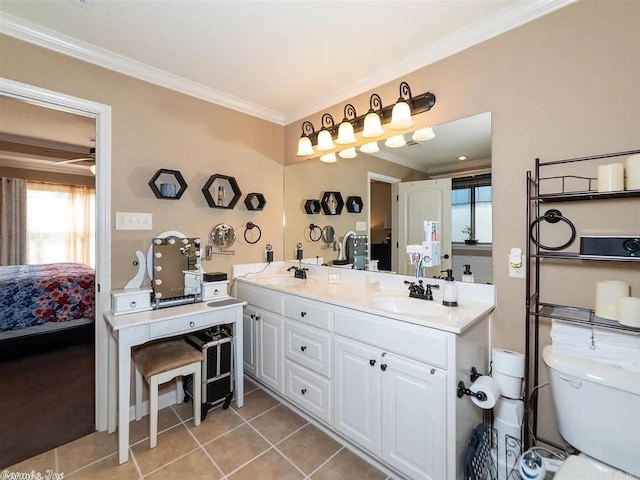 bathroom with tile patterned flooring, vanity, toilet, and ornamental molding