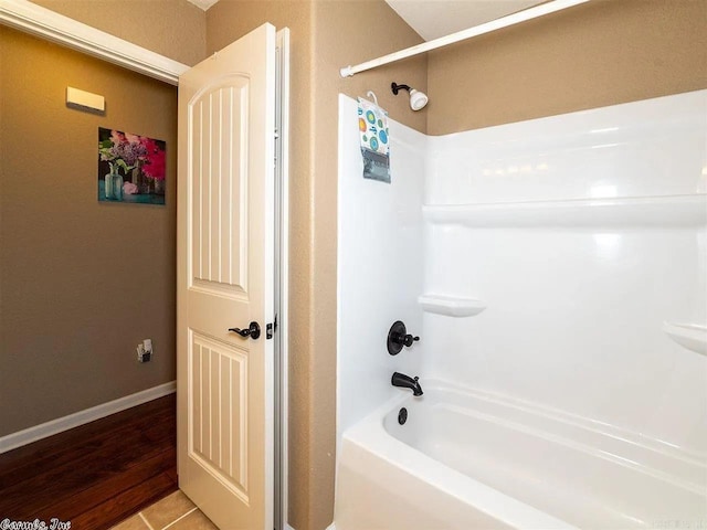 bathroom with shower / tub combination and wood-type flooring