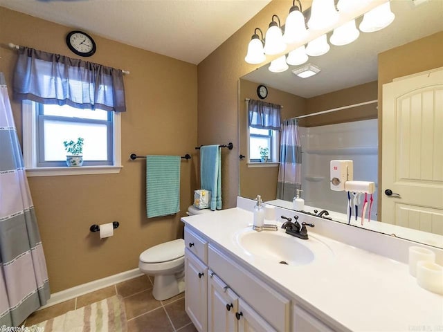 bathroom with tile patterned floors, vanity, and toilet