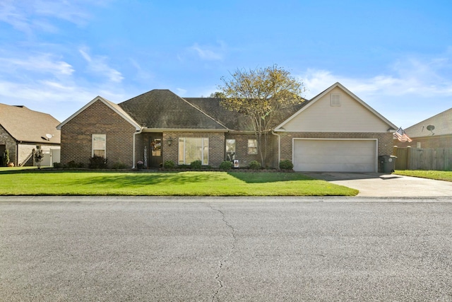 ranch-style home with a front lawn and a garage