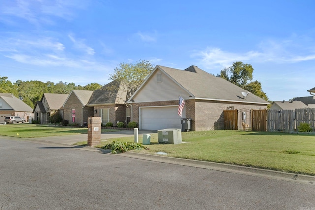 view of front facade featuring a front yard and a garage