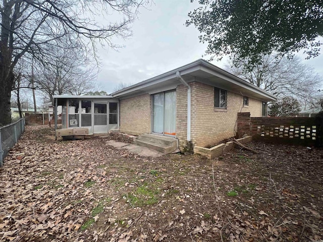 back of house with a sunroom