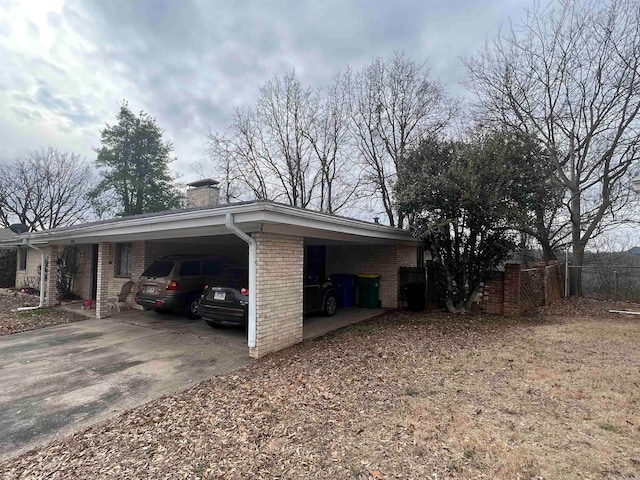 view of home's exterior with a carport