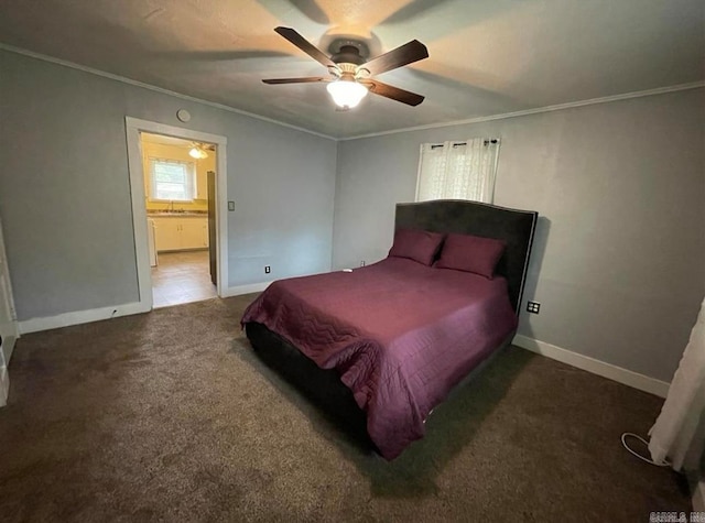 carpeted bedroom with crown molding and ceiling fan