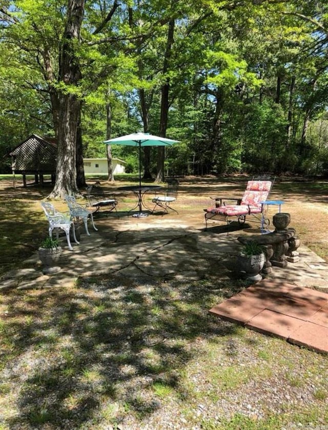 view of property's community with a patio and a gazebo