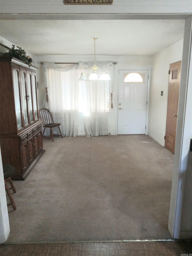 view of carpeted entrance foyer