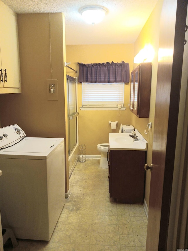 laundry area featuring washer / clothes dryer and sink