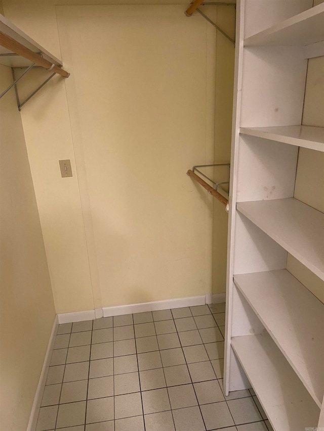 spacious closet featuring light tile patterned floors