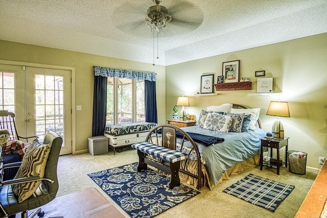 bedroom with french doors, access to outside, carpet flooring, a textured ceiling, and ceiling fan