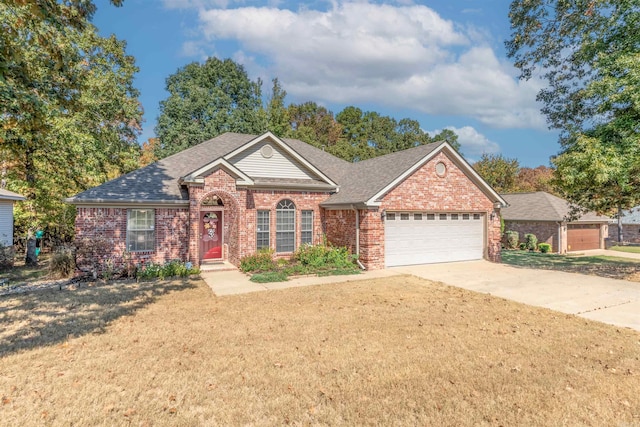 view of front of home featuring a garage and a front lawn