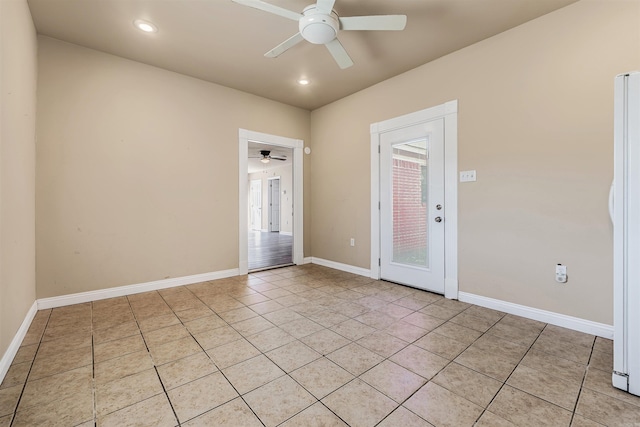 tiled empty room with ceiling fan