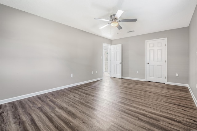 unfurnished bedroom with dark hardwood / wood-style flooring and ceiling fan