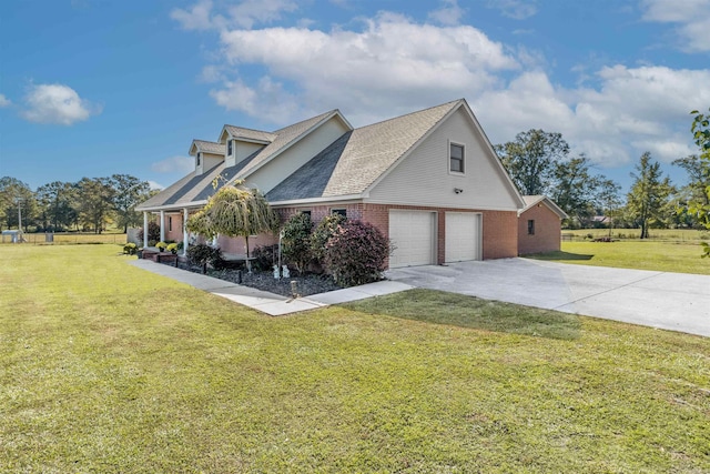 view of side of home featuring a garage and a lawn