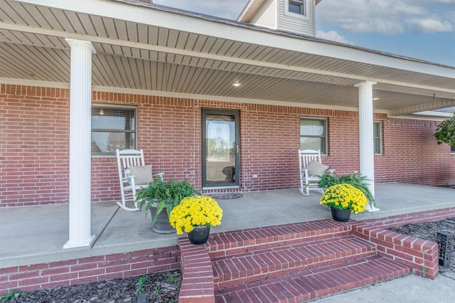 property entrance with covered porch