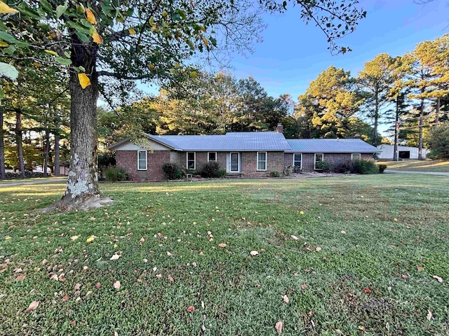 ranch-style house with a front yard