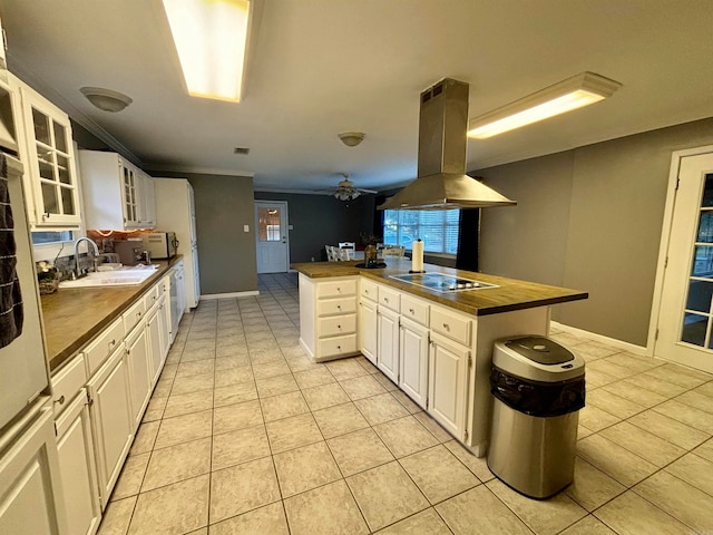 kitchen with sink, island range hood, kitchen peninsula, white cabinets, and electric cooktop