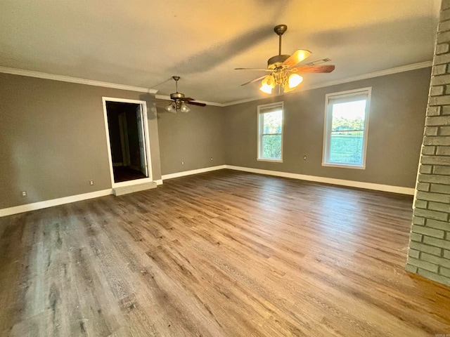 spare room featuring ornamental molding, hardwood / wood-style flooring, and ceiling fan