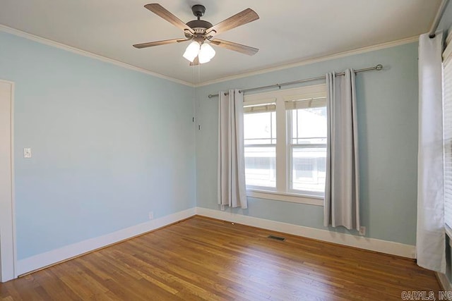 unfurnished room featuring wood-type flooring, ornamental molding, and ceiling fan