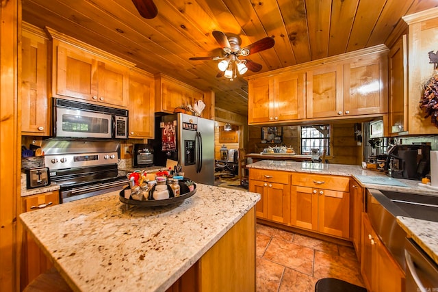 kitchen featuring a kitchen island, stainless steel appliances, wooden ceiling, light stone countertops, and ceiling fan