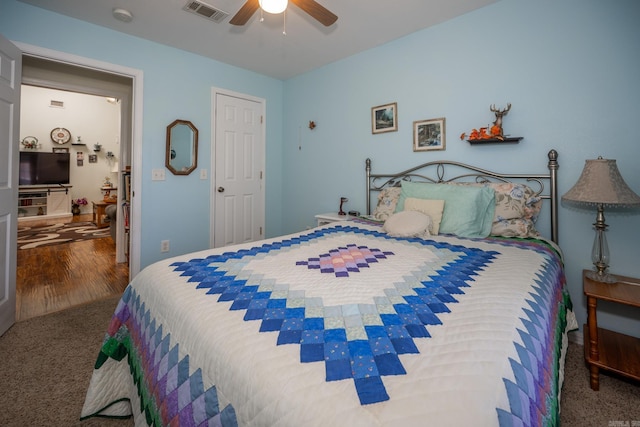 carpeted bedroom with ceiling fan