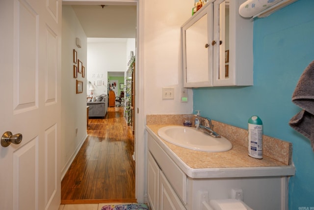 bathroom with vanity and hardwood / wood-style floors