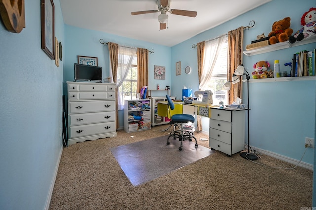 home office with carpet floors and ceiling fan