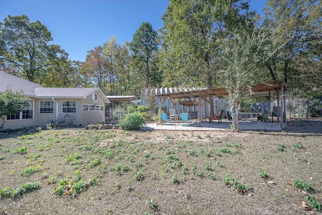 view of yard with a pergola and a patio