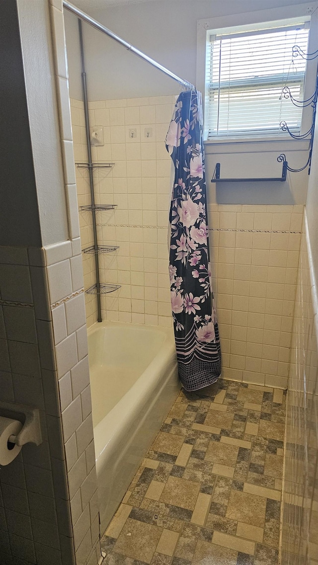 bathroom with shower / bath combination with curtain