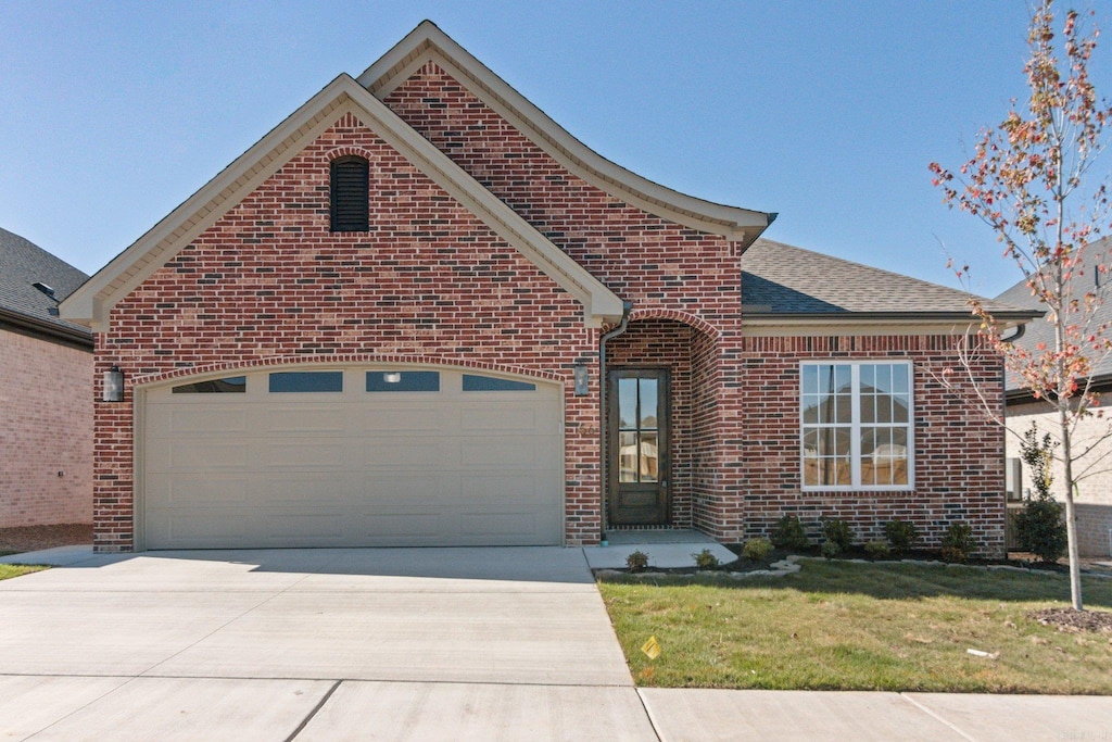 view of property featuring a front yard