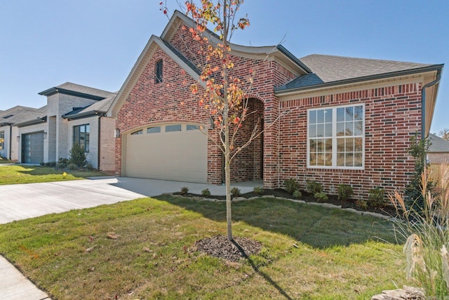 view of front facade with a front lawn and a garage