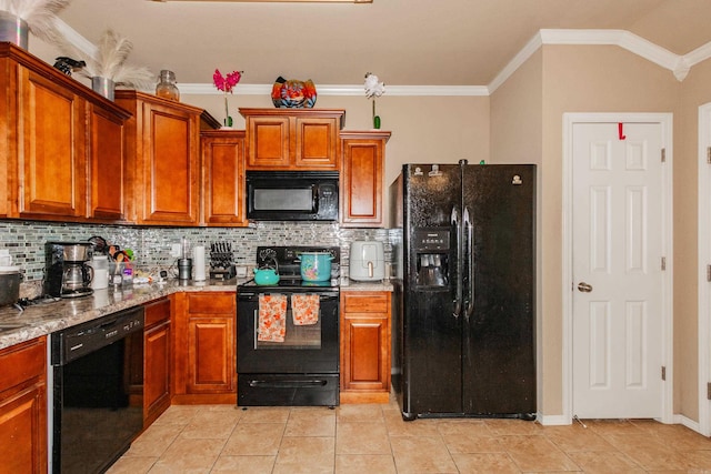 kitchen with ornamental molding, black appliances, light tile patterned flooring, light stone counters, and tasteful backsplash