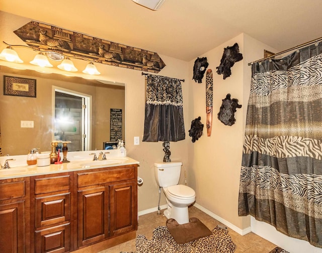 bathroom with vanity, a shower with curtain, toilet, and tile patterned flooring