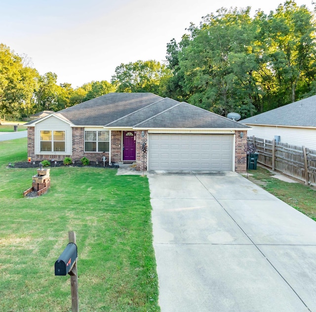 single story home featuring a front lawn and a garage