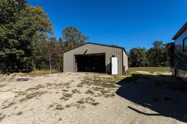 view of outbuilding with a garage