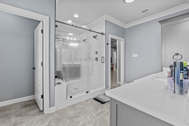 bathroom featuring vanity, ornamental molding, and a shower with shower door