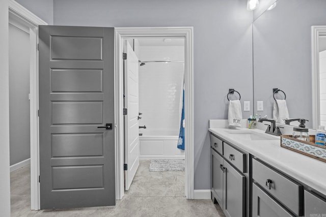 bathroom with vanity, shower / bath combo with shower curtain, and tile patterned flooring