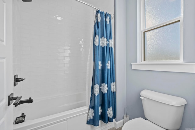 bathroom featuring toilet and shower / bath combo