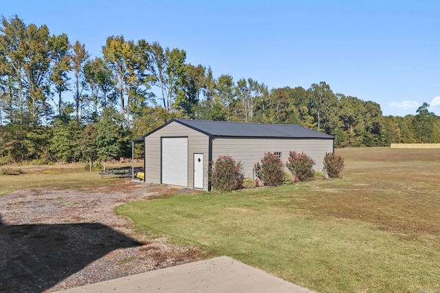 view of outbuilding featuring a yard and a garage