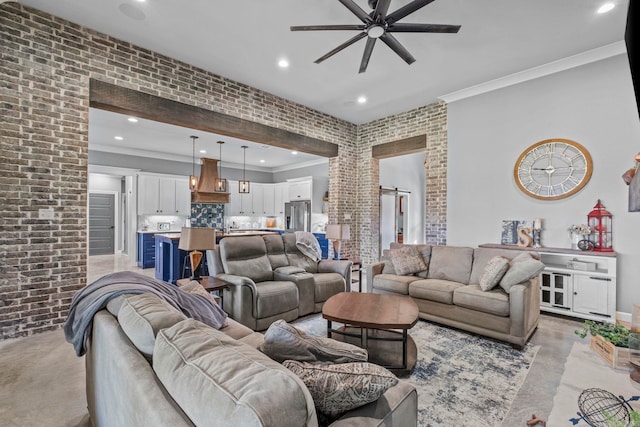 living room featuring crown molding, brick wall, and ceiling fan